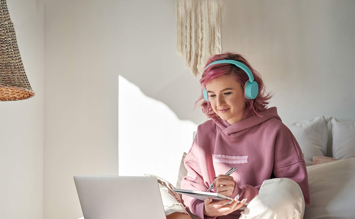 Young girl studying on laptop