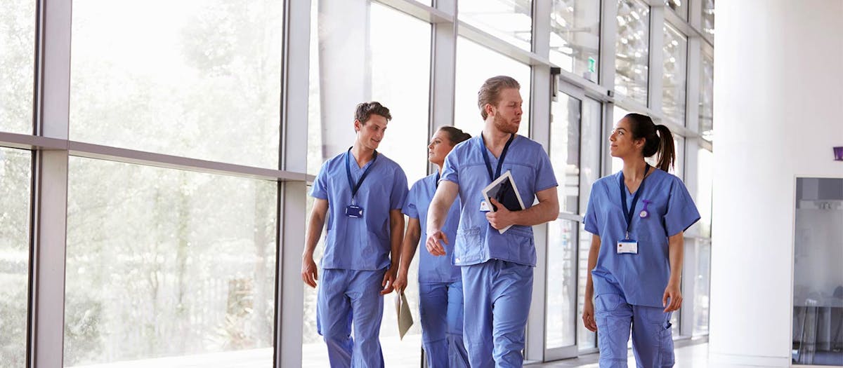 Allied health assistants walking