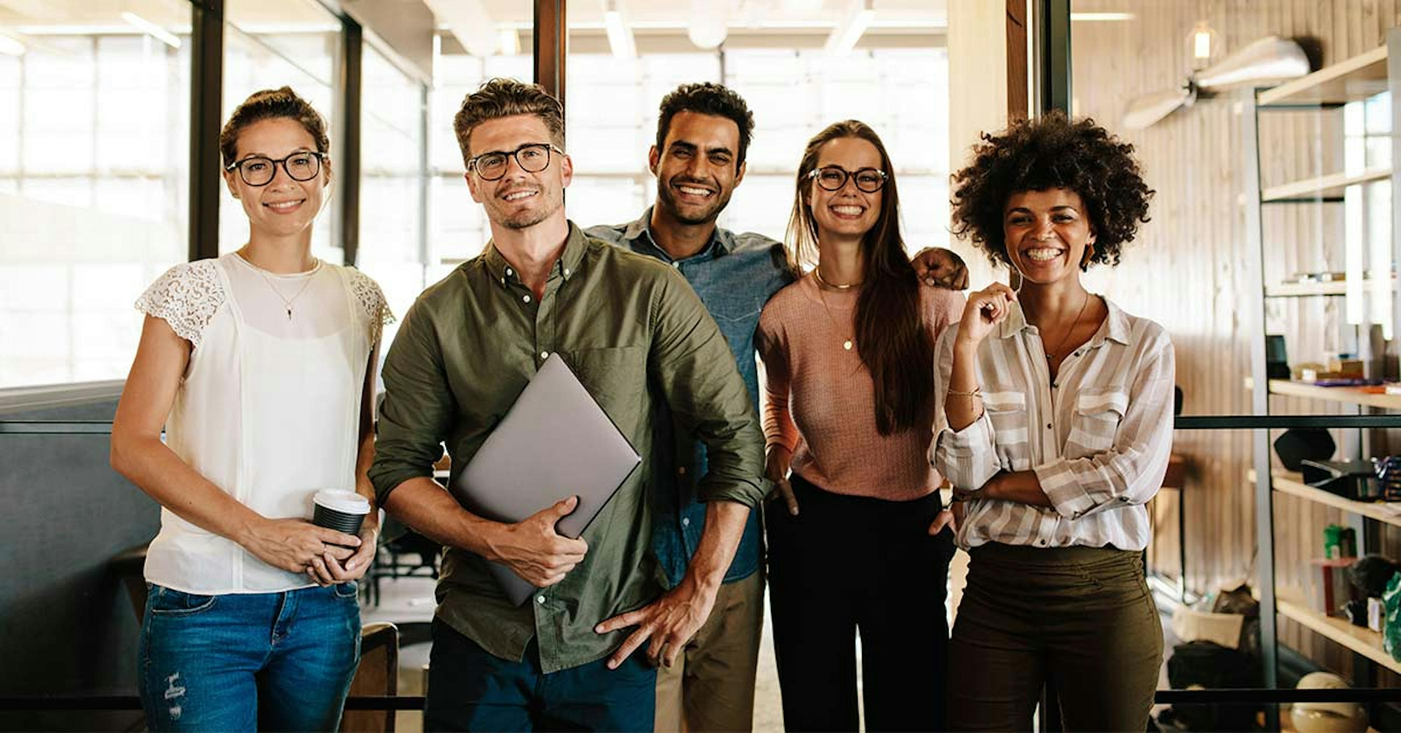 group of men and women in the office