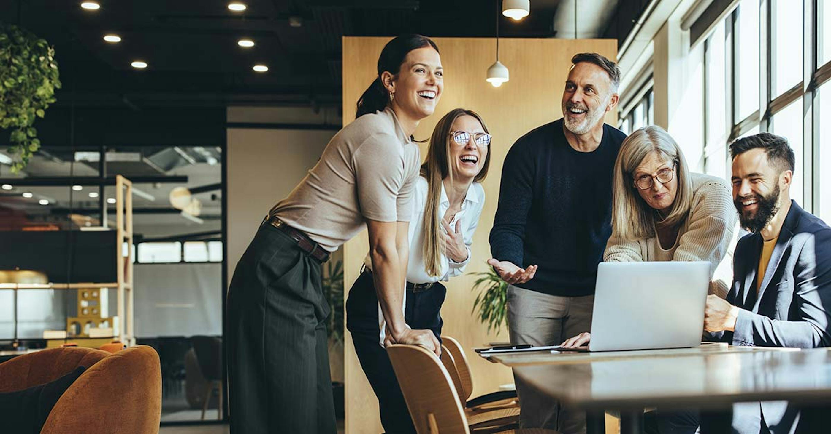 group of men and women in the office