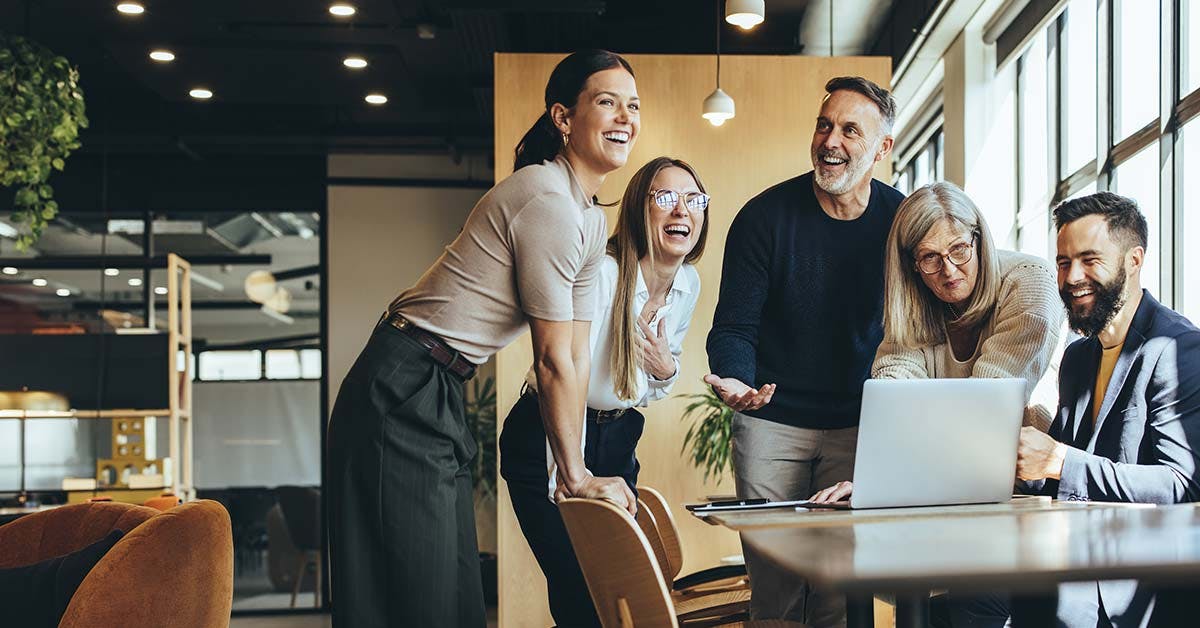 group of men and women in the office