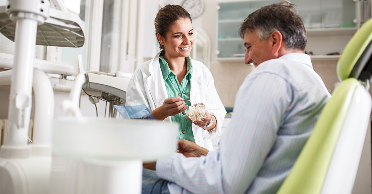 dental assistant and patient