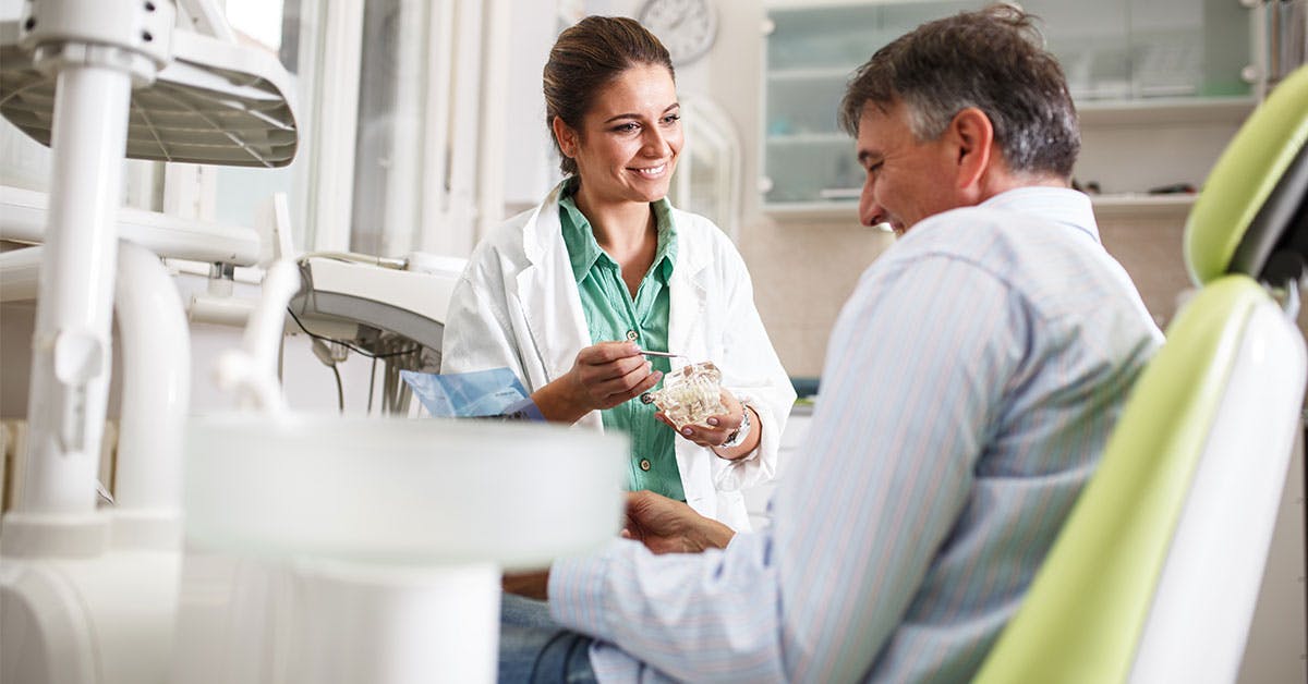 dental assistant and patient