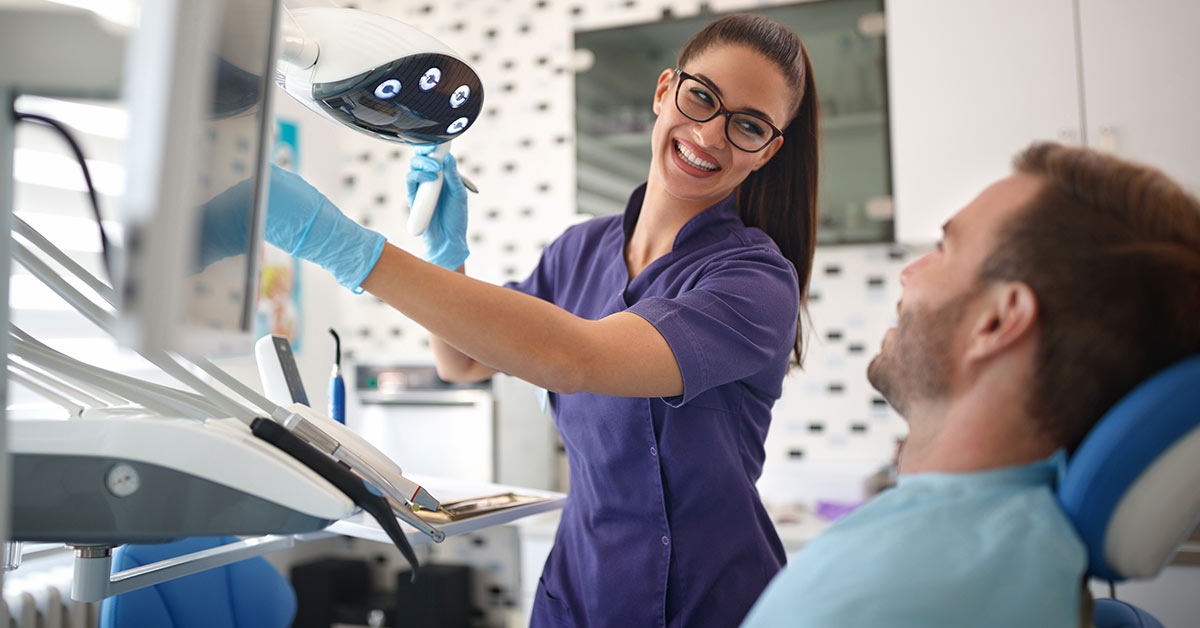 dental assistant and patient