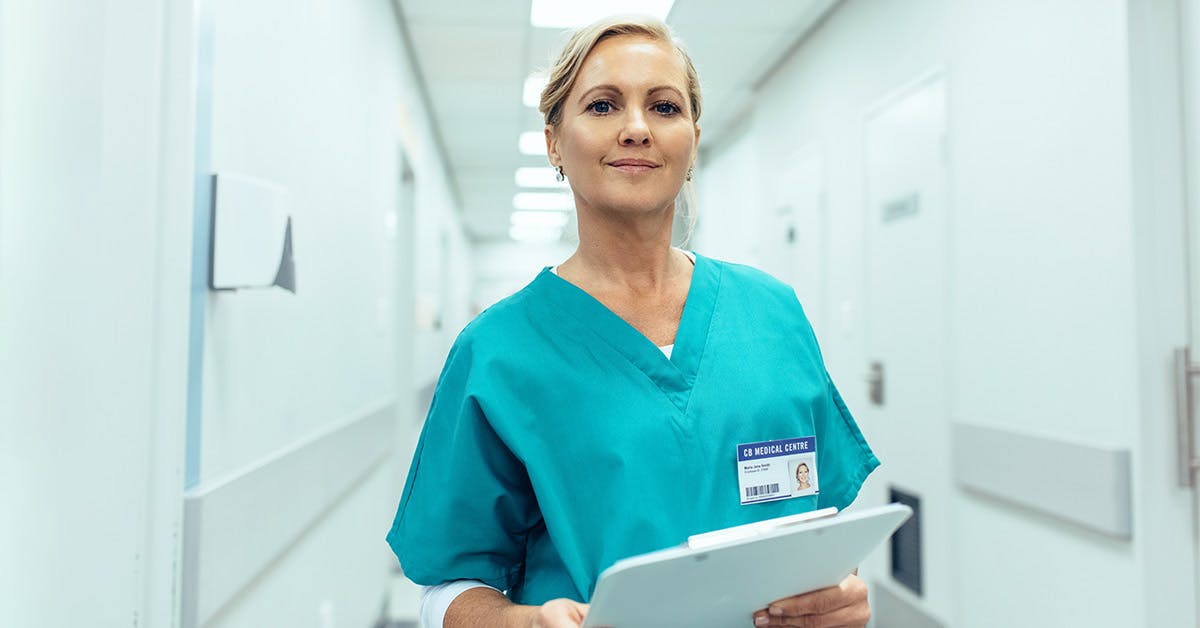 allied health assistant holds clipboard