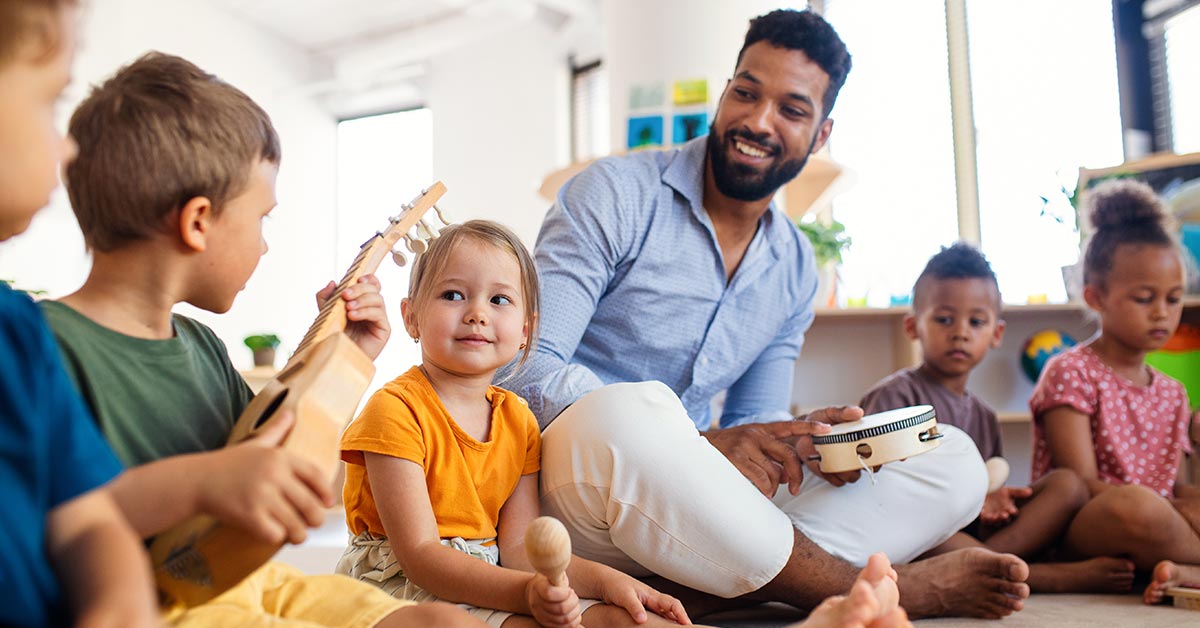 man playing with children