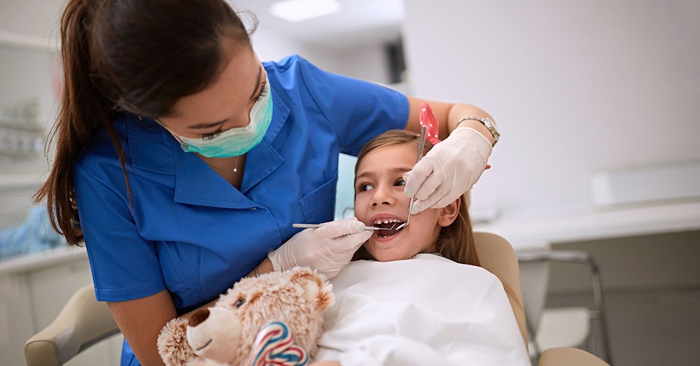 dental assistant and patient