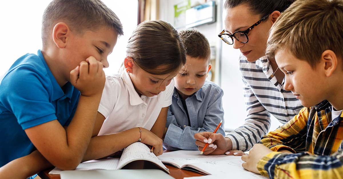 teacher aide with children