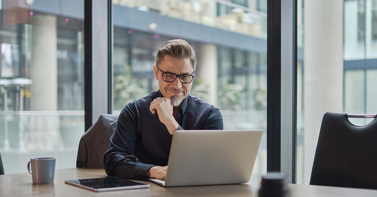 Businessman using laptop in office