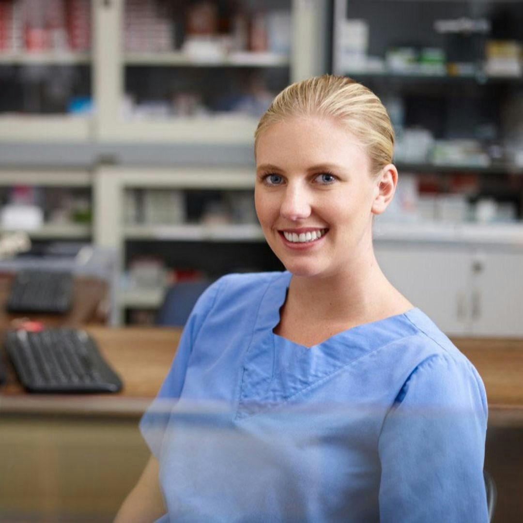 Medical receptionist at her desk