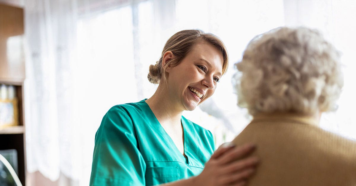 A female patient is being reassured by an Allied Health Assistant