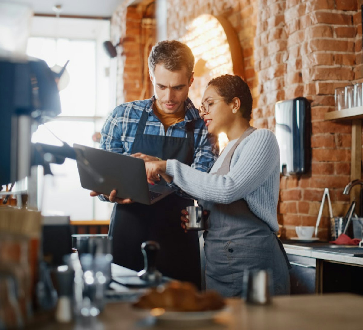 Man and woman running cafe