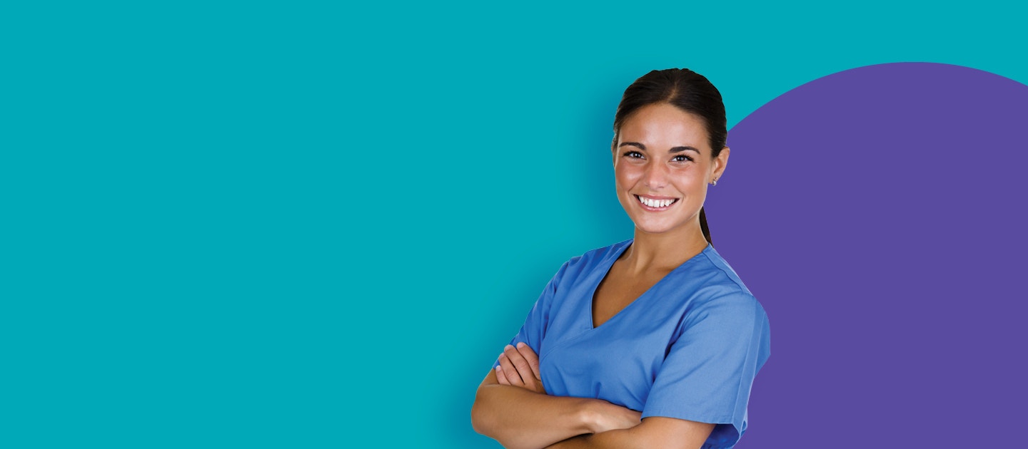 Smiling dental assistant in scrubs
