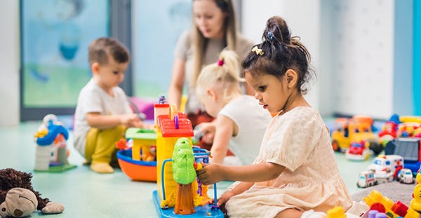 Girl toddler playing with kids toys