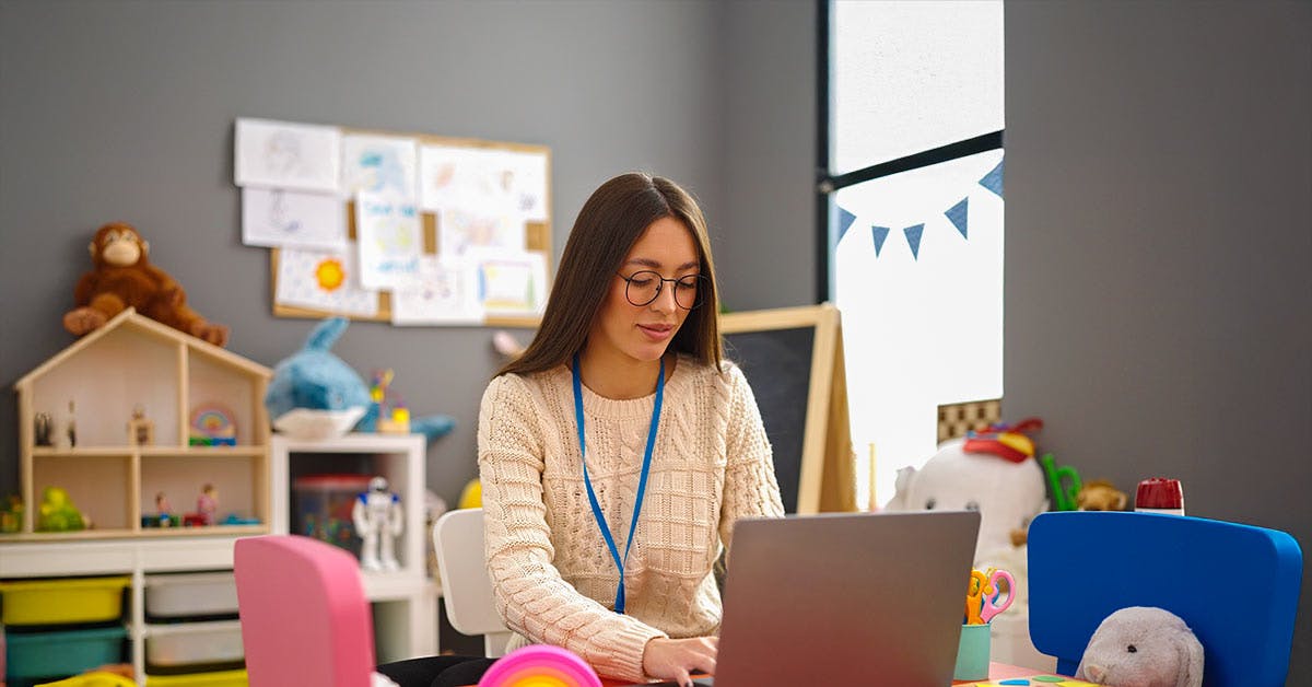 Early Childhood educator using a laptop