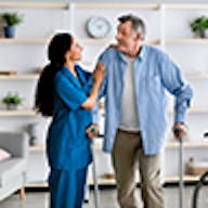 Woman helping man on crutches