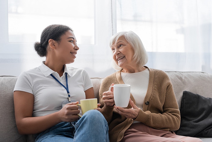 Student providing care to elderly woman at home 2