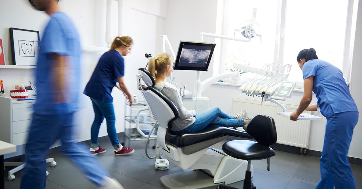 Dental assistants working in dental clinic