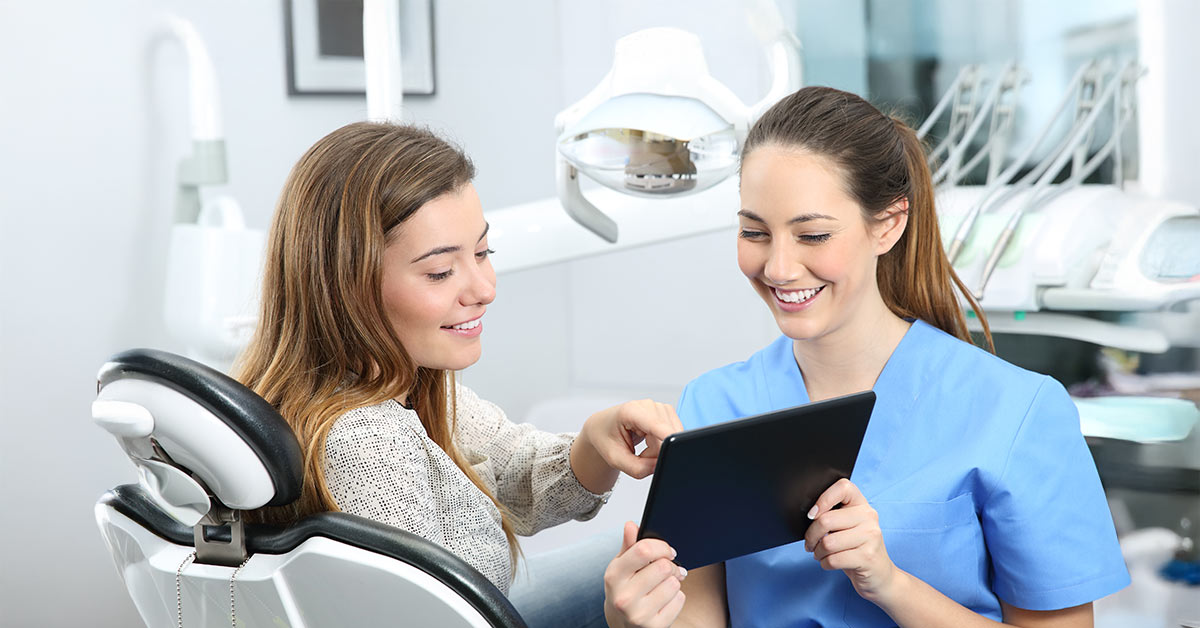 Dental Assistant at Work with patient