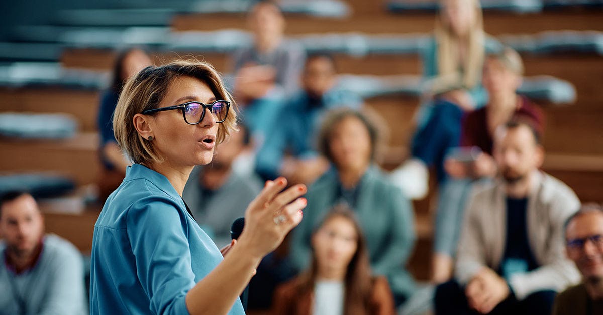 Business leader in front of group