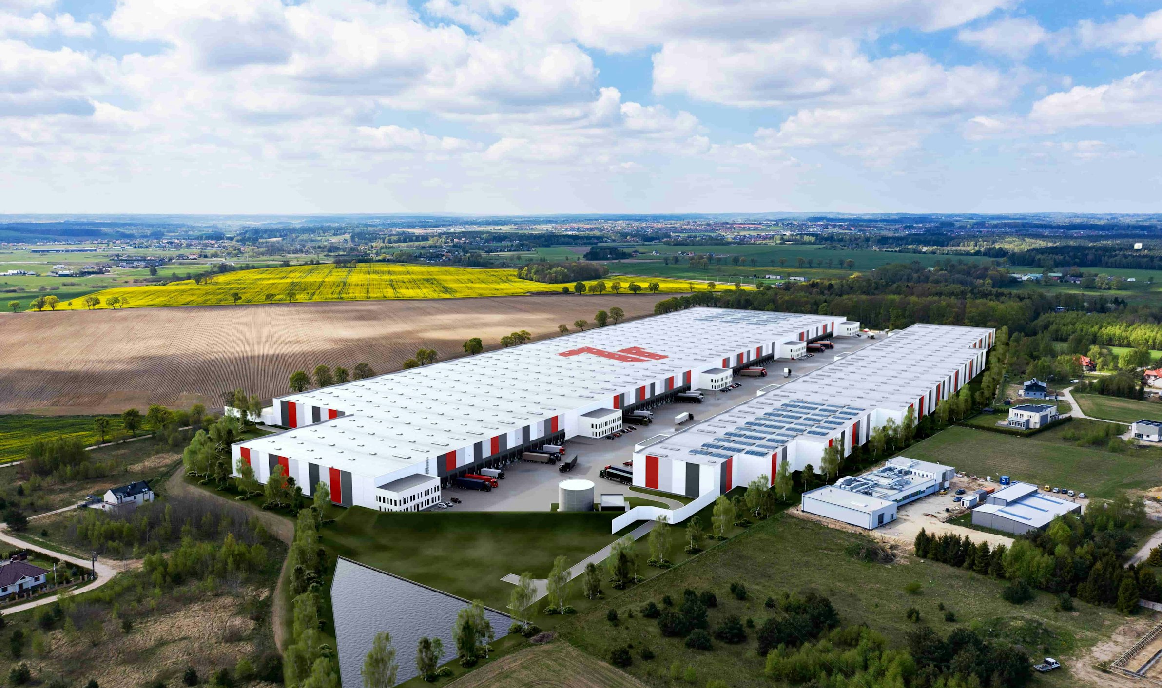 WOOD & Company enters with a new real estate fund into the logistics segment. The first acquisition is in Poland.