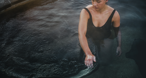 lady moving water with her hands