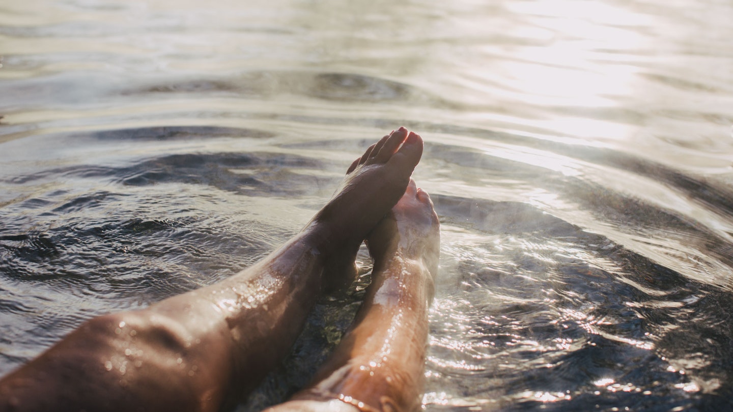 a woman's feet in water