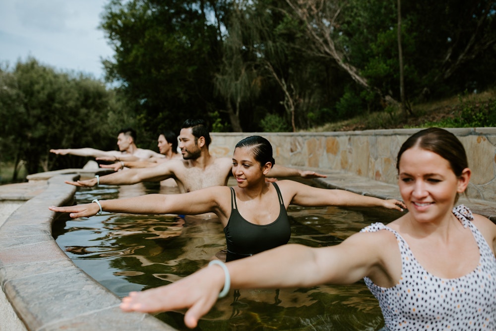 Hot spring yoga close up of group