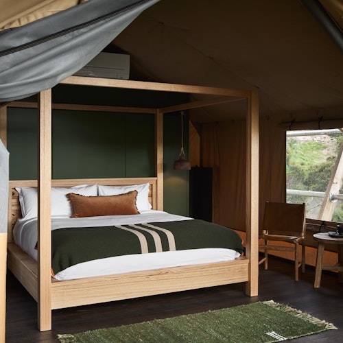 luxurious safari style glamping tent with king bed