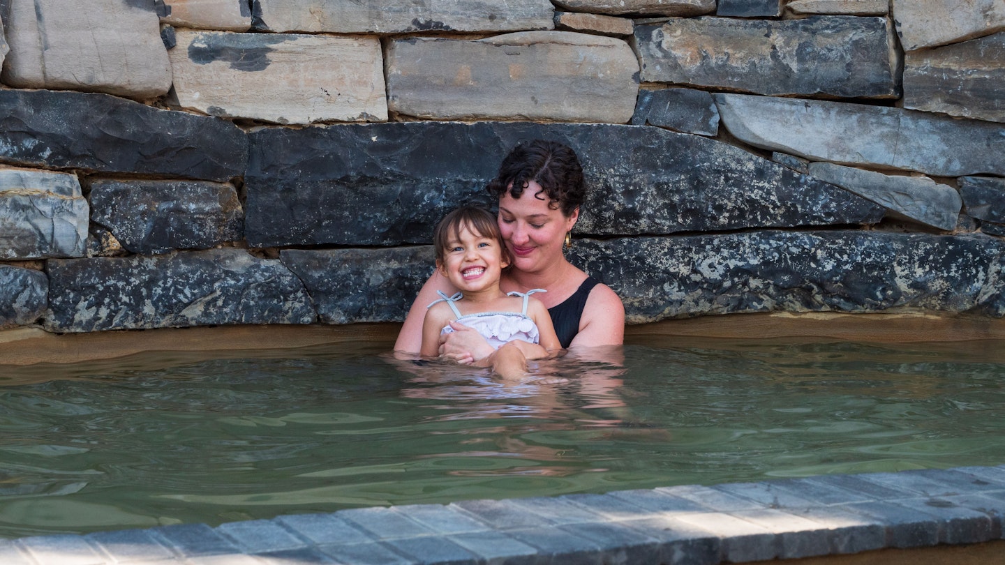 mother and daughter bathing at metung hot springs