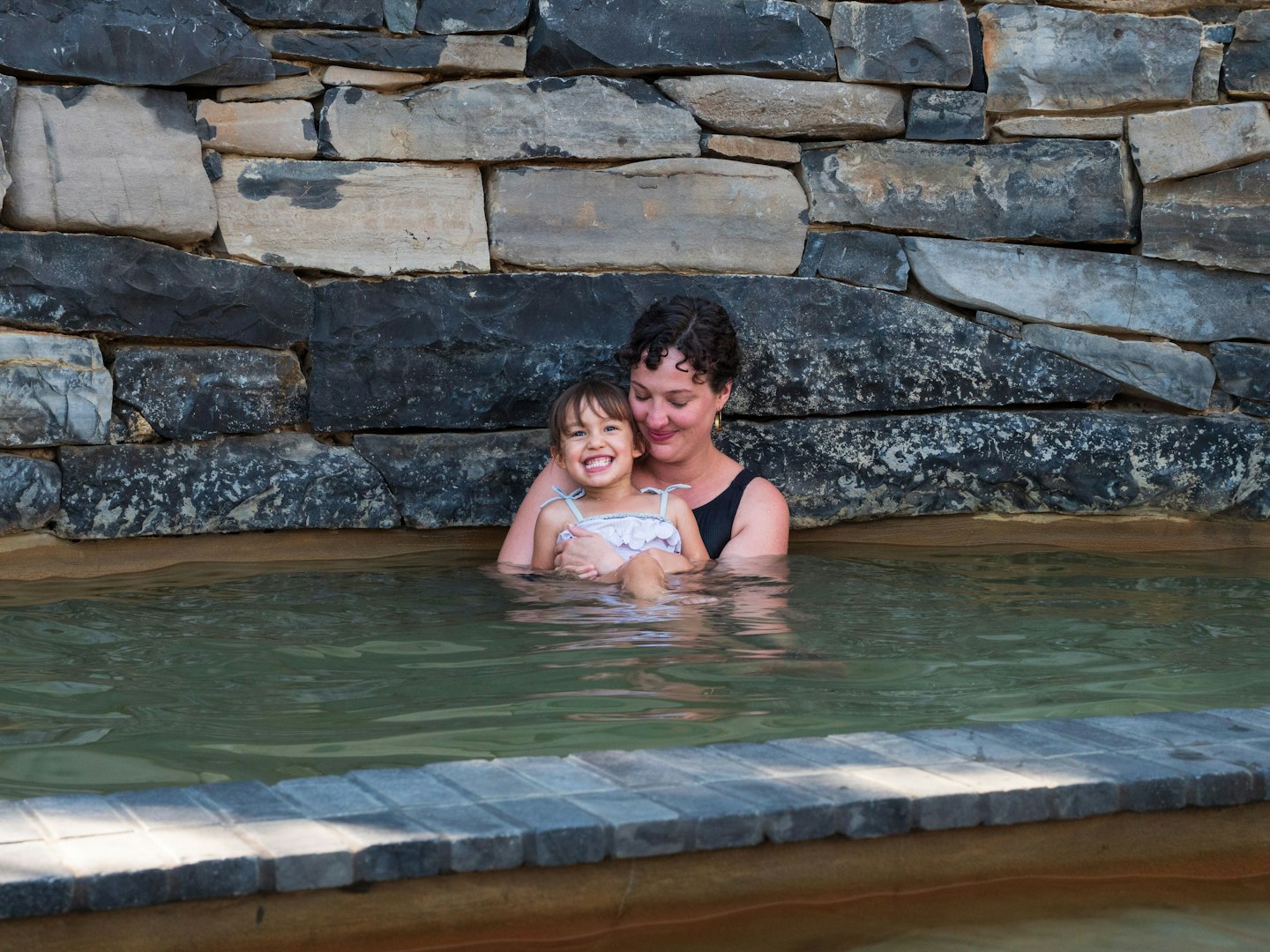 mother and daughter bathing at metung hot springs