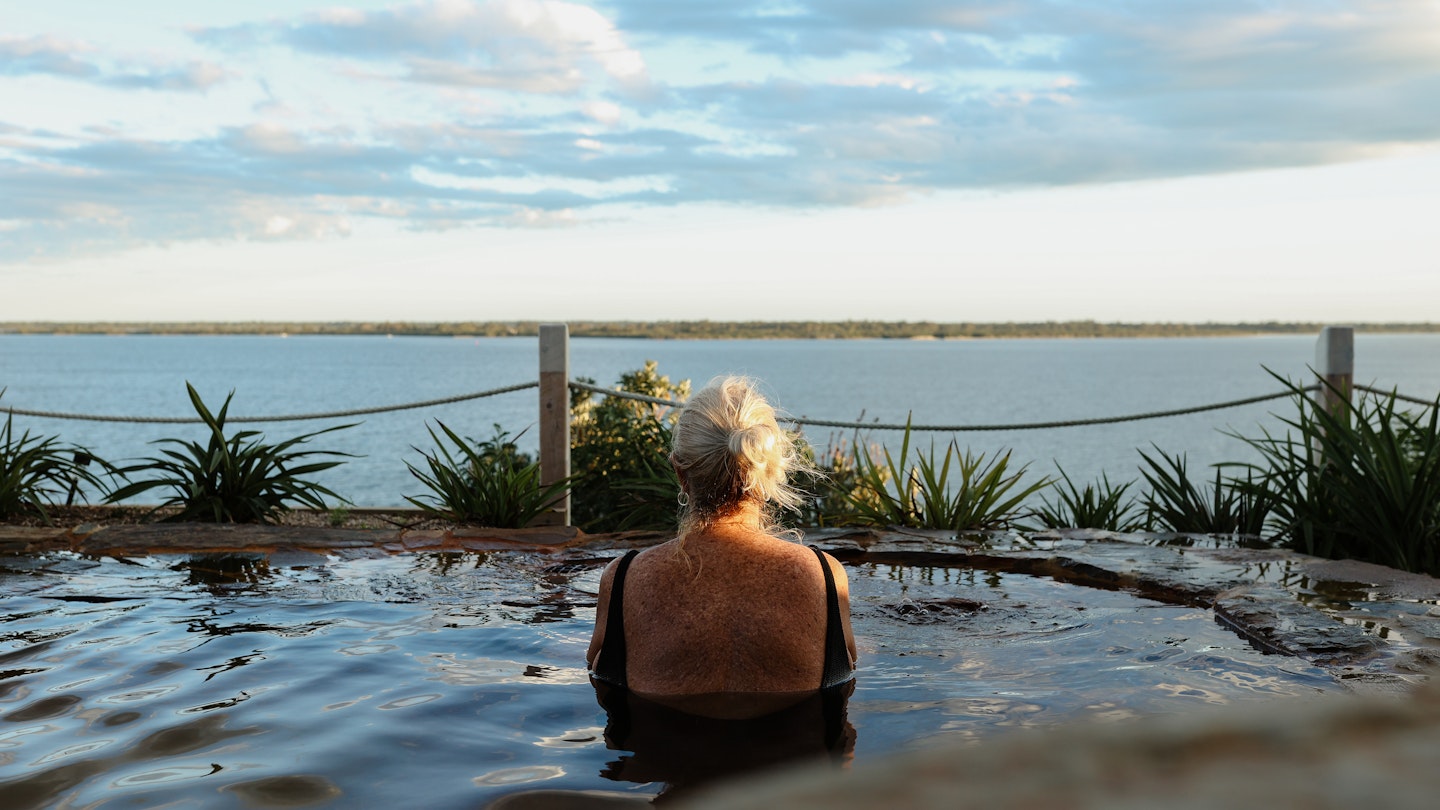 woman admiring gippsland lakes views from metung hot springs