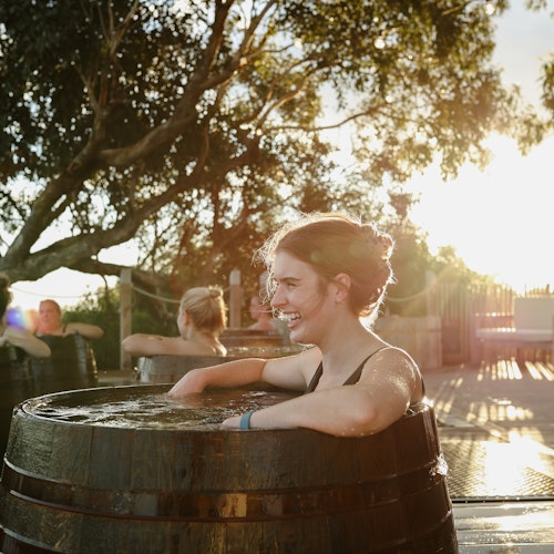 woman bathing in bathing barrel