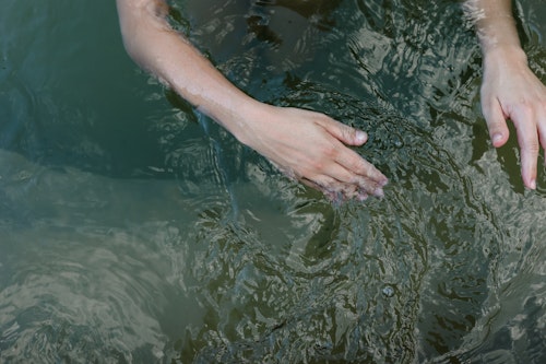 hand moving through water