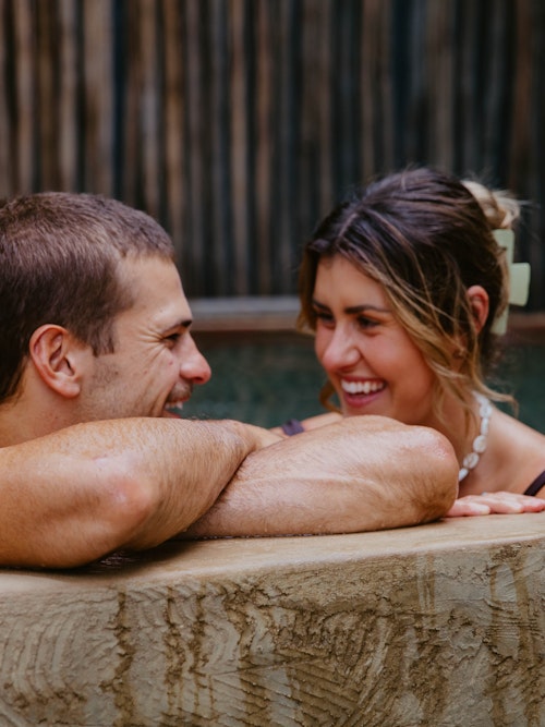 couple bathing in metung hot springs wombat pool