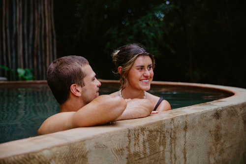 A couple bathing in geothermal springs