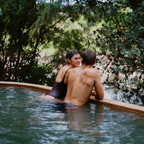 couple bathing at metung hot springs