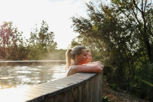 two women bathing at metung hot springs
