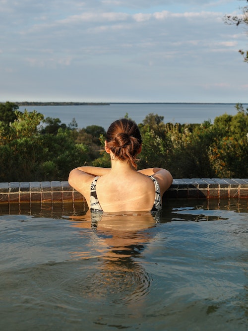 woman bathing at metung hot springs