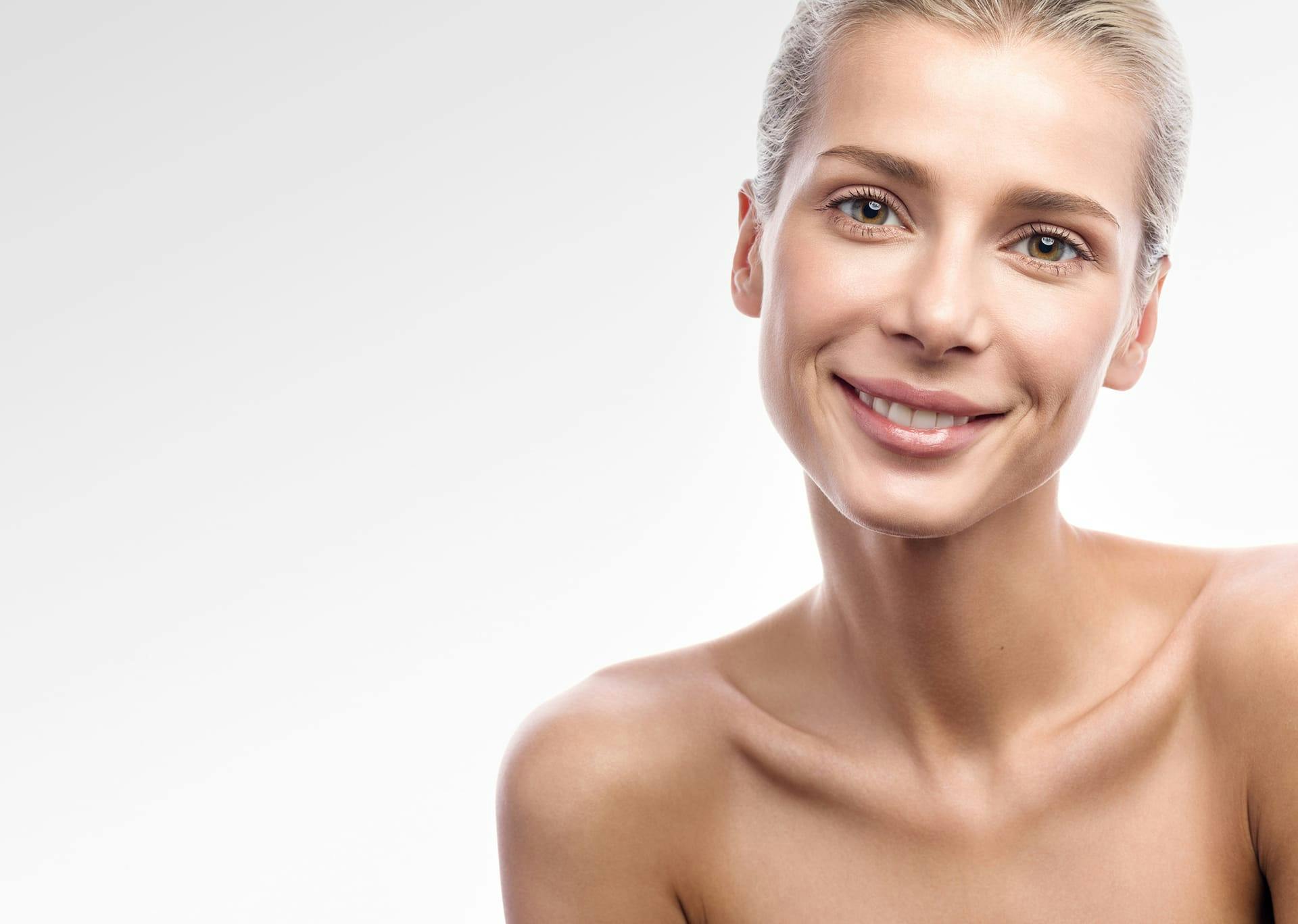 Woman smiling into the camera highlighting hormone replacement therapy in Southlake