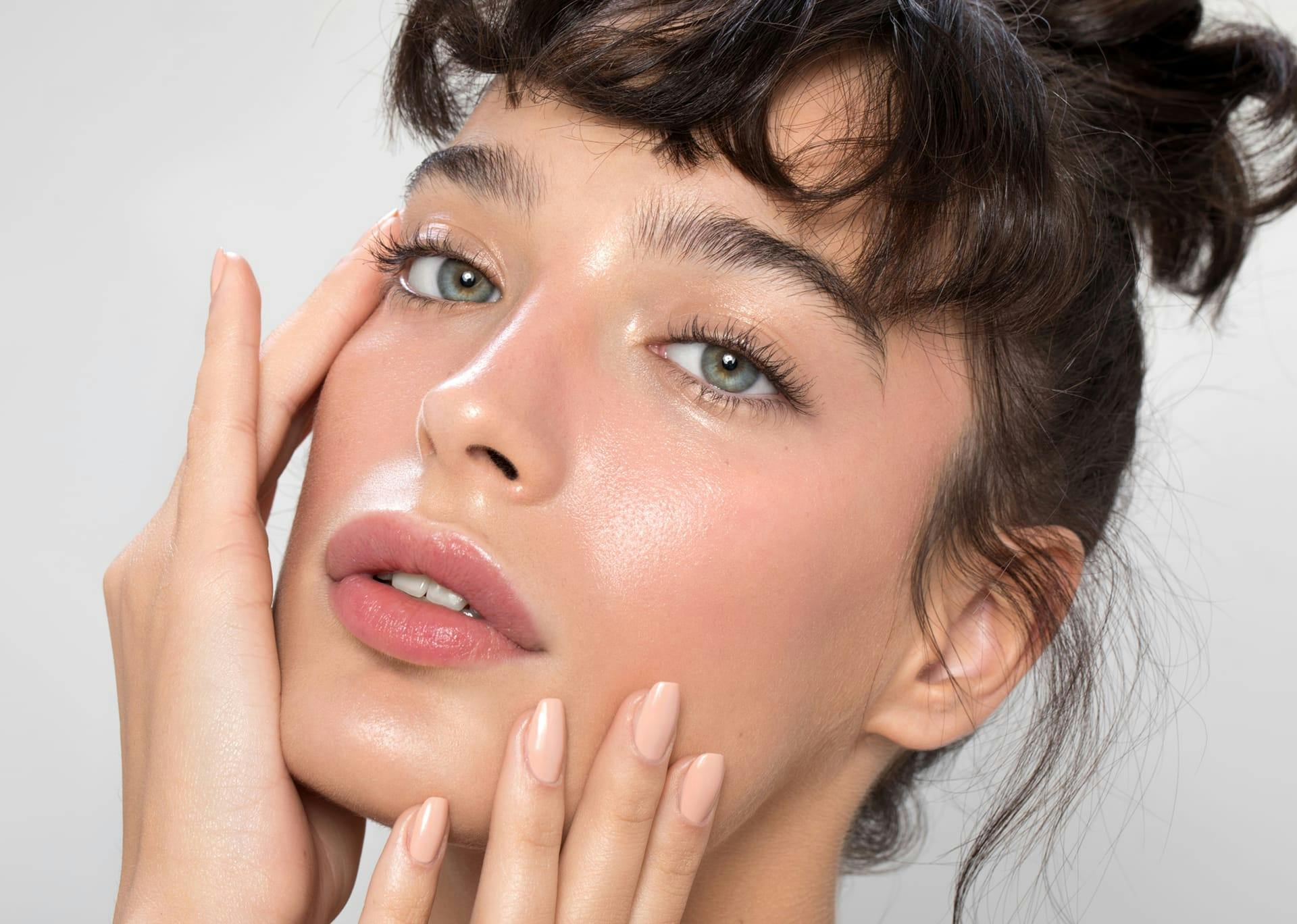 A woman's face with glowing skin