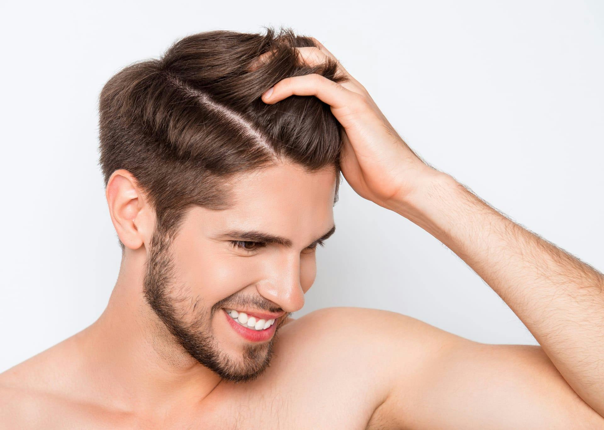 Man running his fingers through his hair 