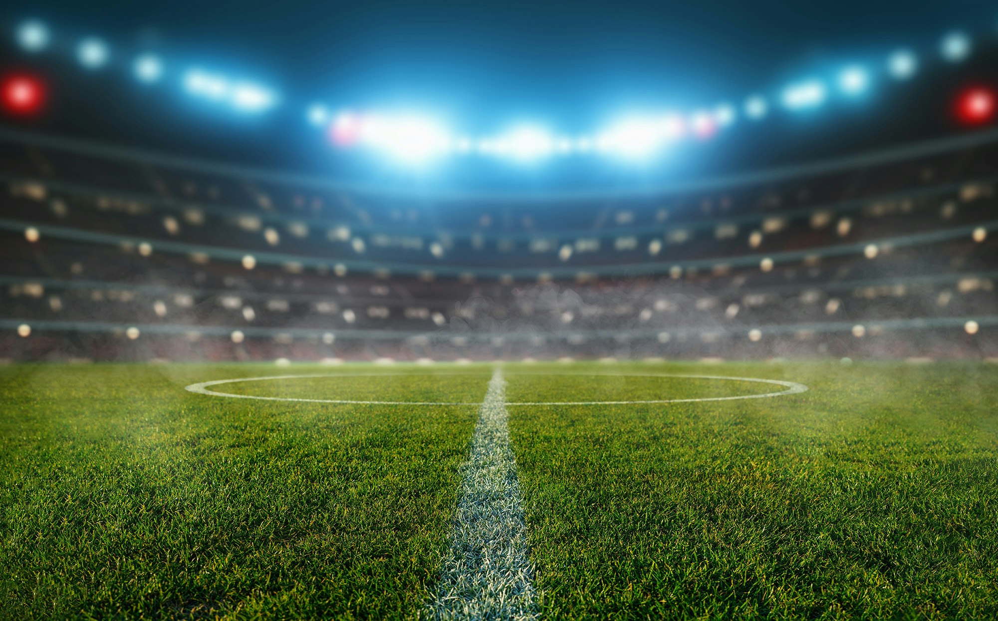 3D-illustrasjon av en opplyst fotballstadion.