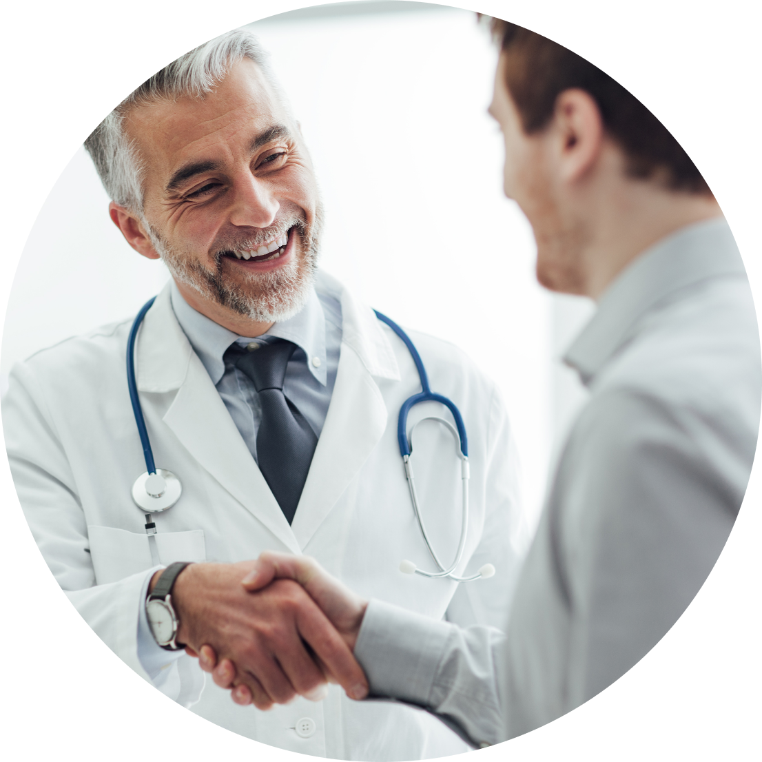 Doctor shaking hands and smiling with someone.