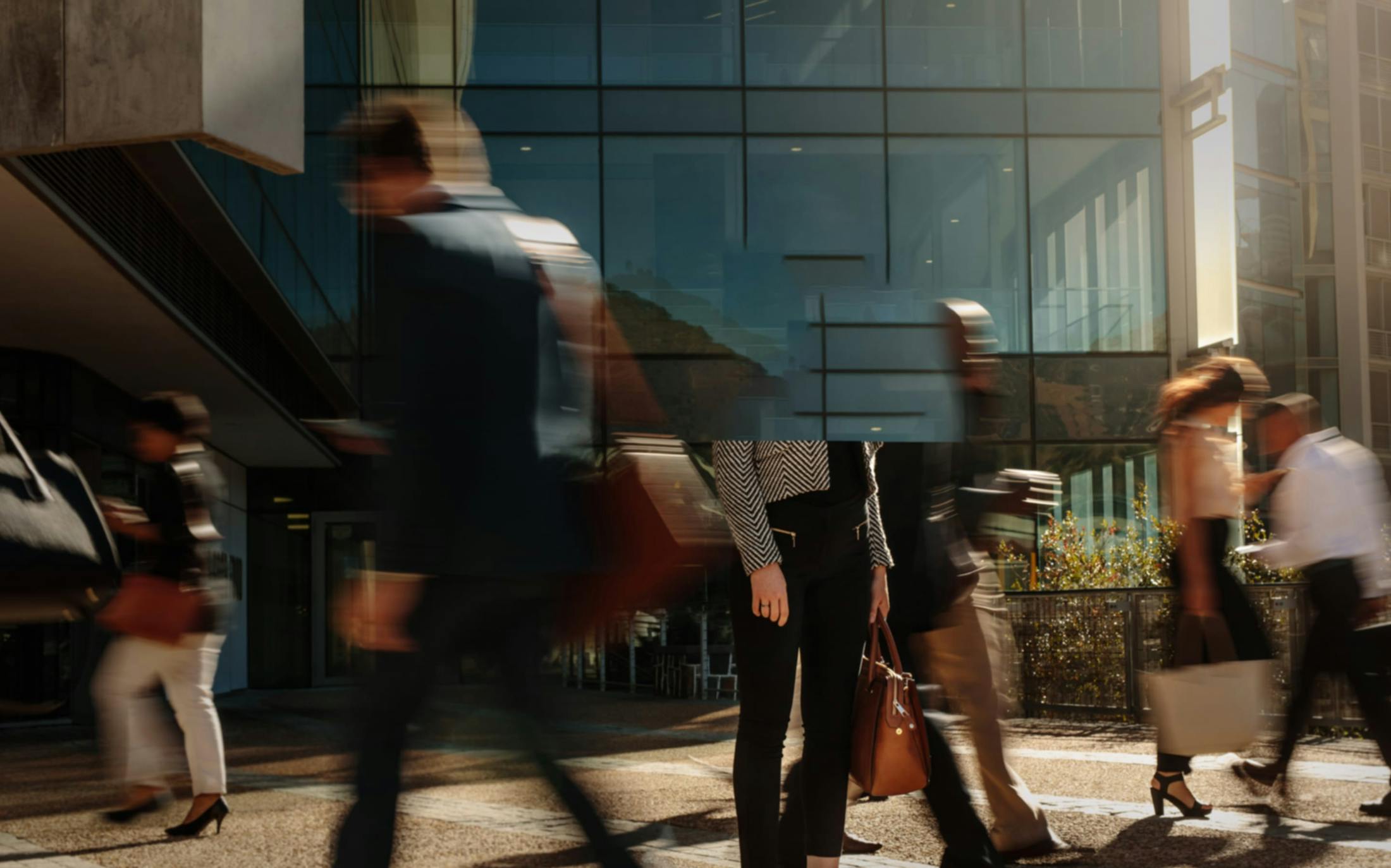 People walking next to a building.