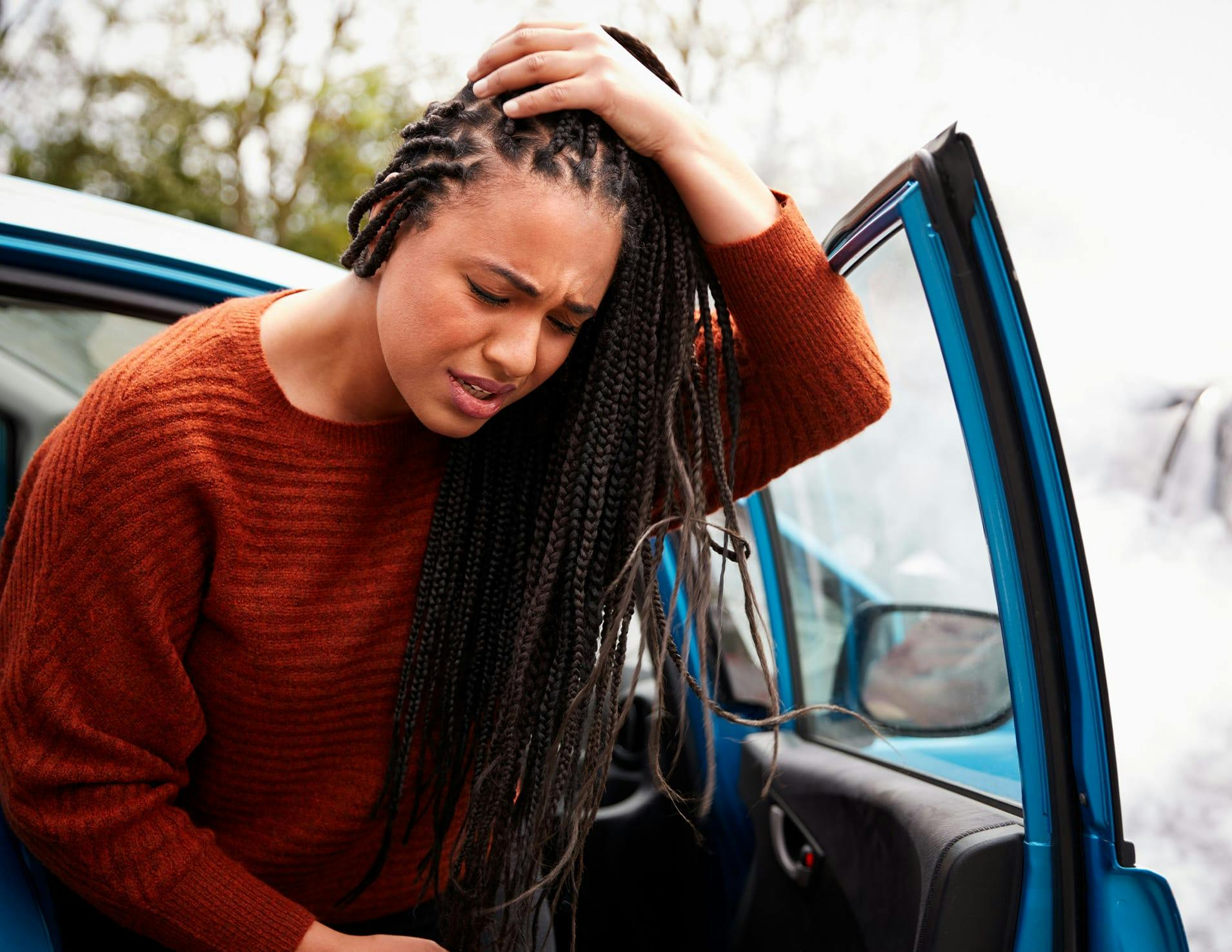 Woman rubbing her head