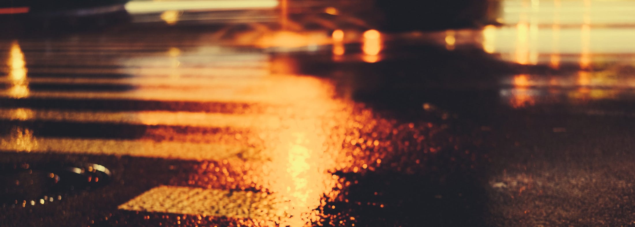 Lights reflecting off of a wet street