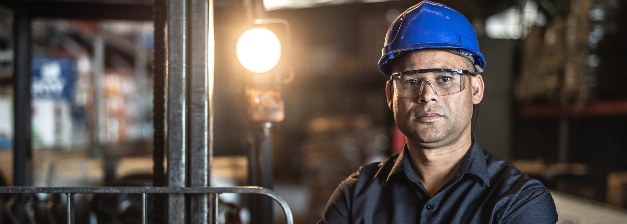 man in a hardhat in a warehouse