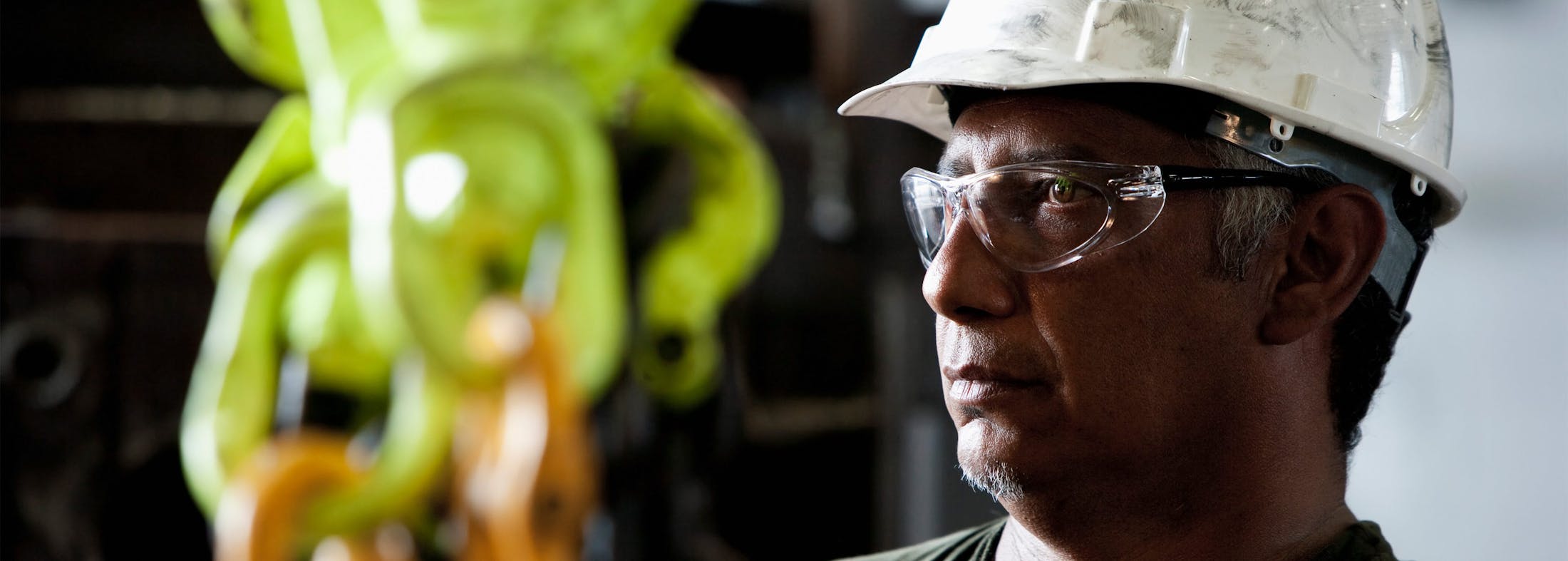 Man wearing a hard hat and safety glasses