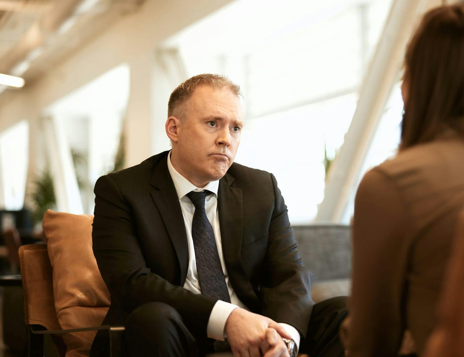 Ben Swanson listening to a client speak.